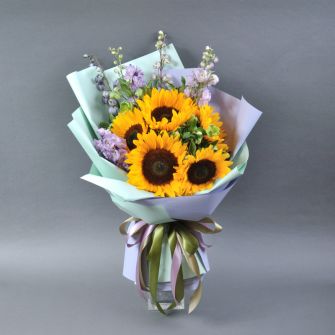 Bouquet with sunflowers and delphinium