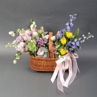 Arrangement in a basket "Floral smile of spring"