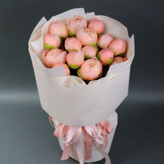 A bouquet of soft coral peonies