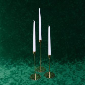 Candlesticks with candles a set of 3 pieces.