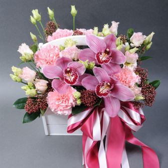 A composition in a orchids, eustoma, dianthus