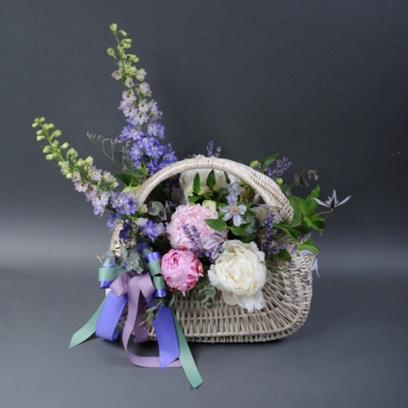 Composition with peonies in the basket 