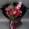 Bouquet of cymbidium orchids with peonies, lilacs and protea - Photo 1