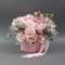 Composition of Pink Mondial roses, eustomes and dianthus in a wooden flowerpot - Photo 1