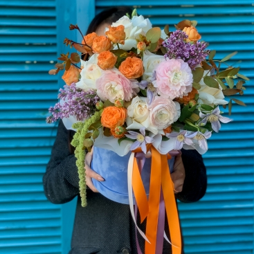Arrangement in a velvet box with ranunculus